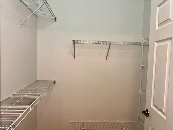 a view of a room with racks on the wall
