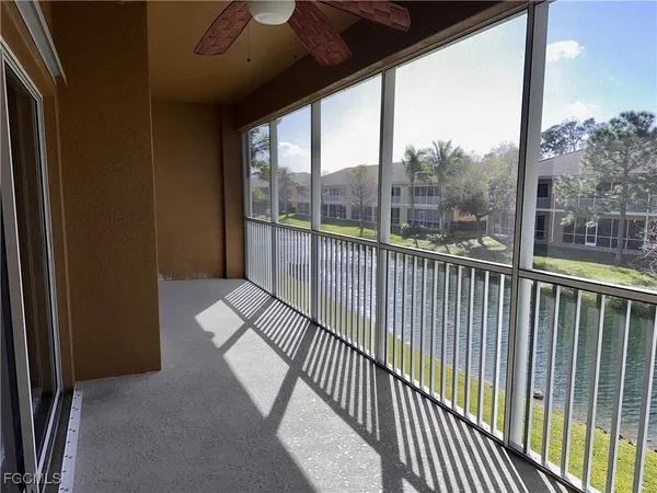 a view of a balcony with wooden floor