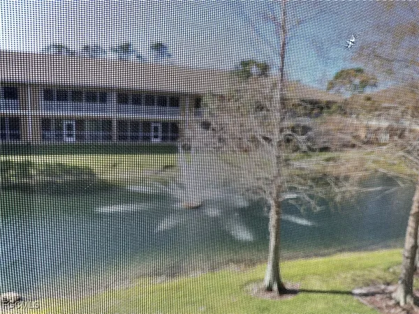 a bathroom with a granite countertop toilet and sink