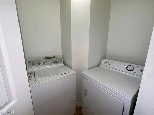 a view of an swimming pool with outdoor seating