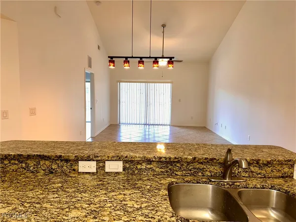 a view of a kitchen with a sink