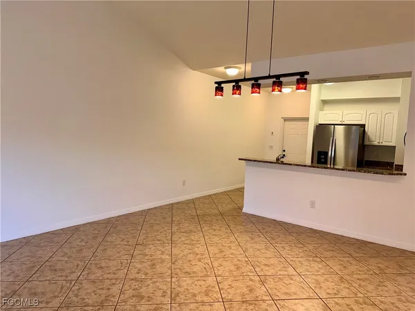 a view of a kitchen with microwave and cabinets