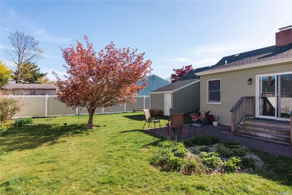a front view of house with yard and seating space
