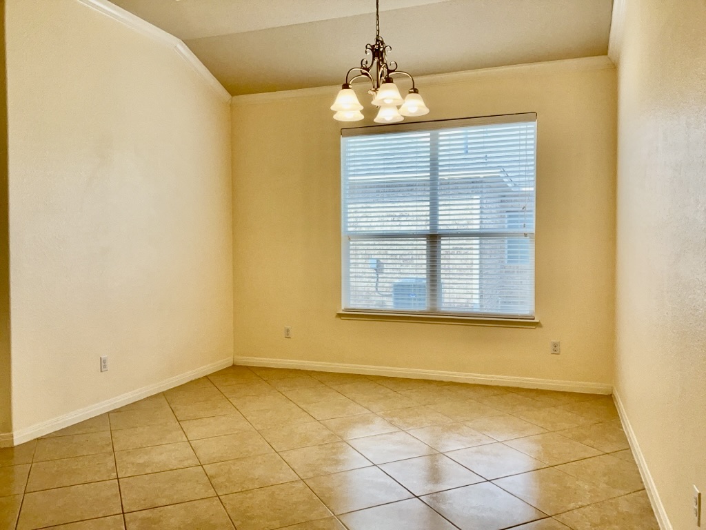2946 Todd Trail Round Rock, TX 78665 - Photo 12 of 31 Formal dining room with ornamental molding, light tile patterned floors, suspended lighting, and vaulted ceiling