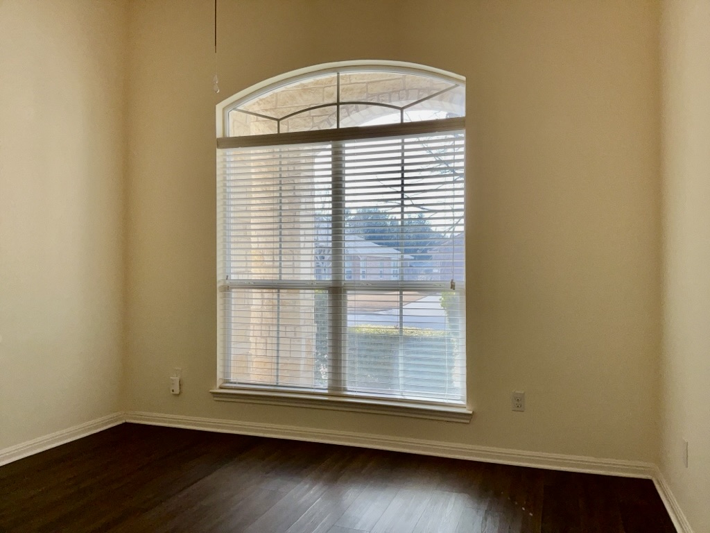 2946 Todd Trail Round Rock, TX 78665 - Photo 19 of 31 Bedroom featuring baseboards and dark wood-style flooring