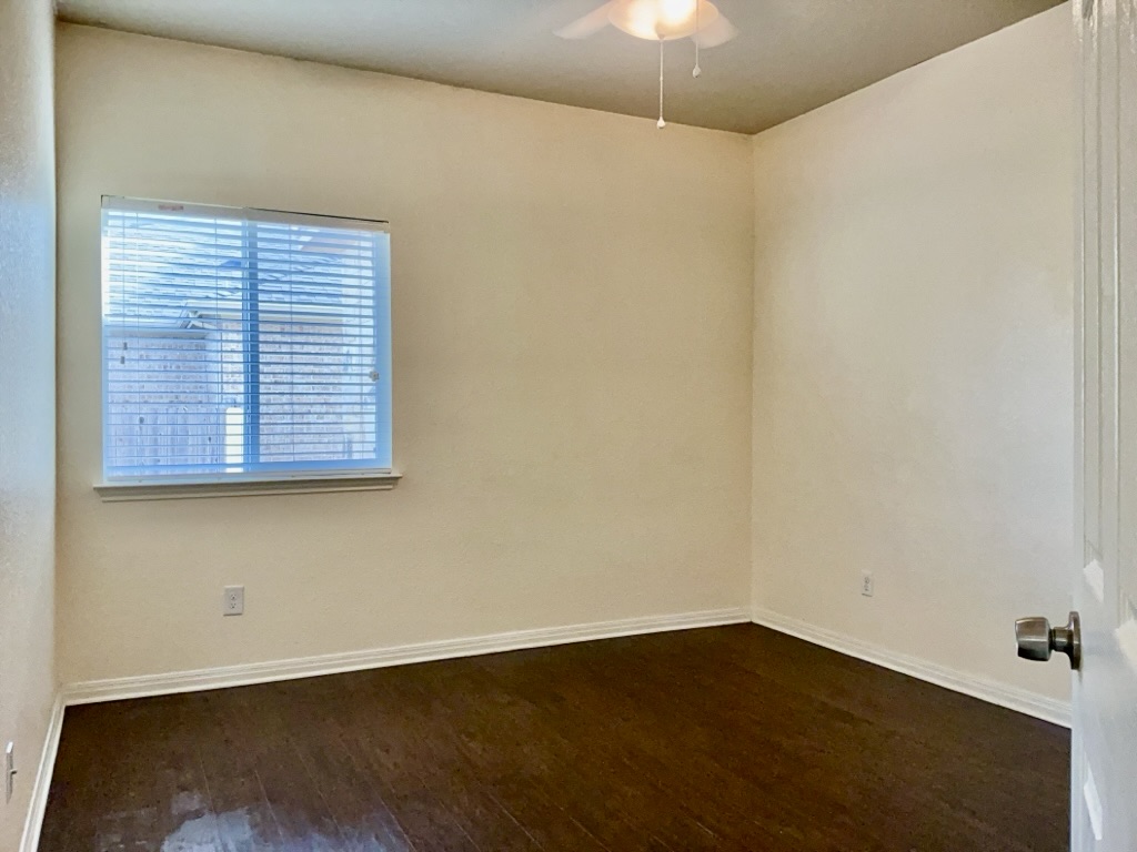 2946 Todd Trail Round Rock, TX 78665 - Photo 22 of 31 Bedroom featuring dark wood finished floors and a ceiling fan