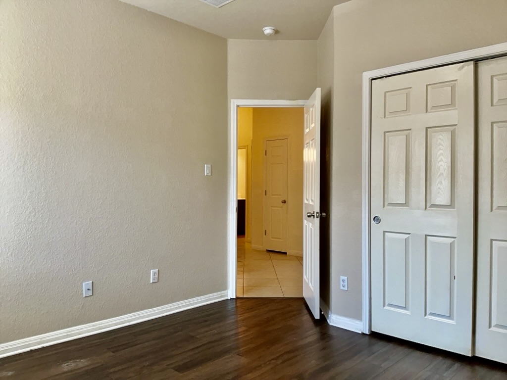 2946 Todd Trail Round Rock, TX 78665 - Photo 26 of 31 Bedroom featuring dark wood finished floors and a closet