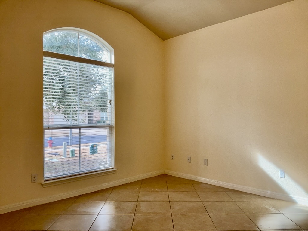 2946 Todd Trail Round Rock, TX 78665 - Photo 28 of 31 Tiled flex room with baseboards and lofted ceiling