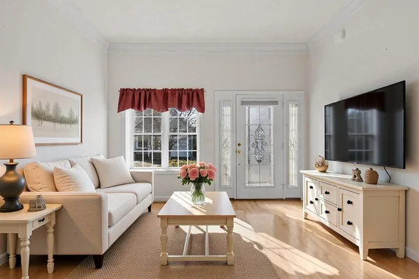 a open kitchen with stainless steel appliances granite countertop a stove top oven a refrigerator and a wooden floor