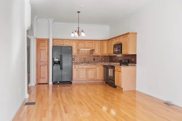 a view of kitchen sink and cabinet