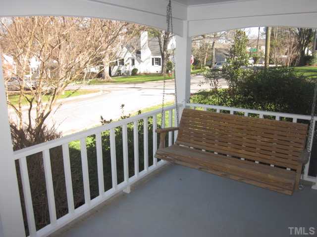 2031 Reaves Drive Raleigh, NC 27608 - Photo 3 of 25 Sit back and relax while swinging on your porch! Tons of updates including tilt in double hung windows, paint inside and outside, roof, HVAC and refinished hardwood floors!