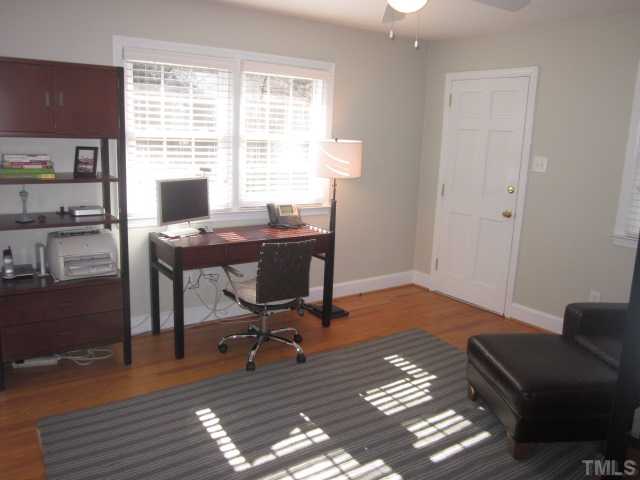 2031 Reaves Drive Raleigh, NC 27608 - Photo 19 of 25 This is one of the secondary bedrooms currently being used as an office! The door leads outside to the back yard area! Bedroom features ceiling fan with light kit, data ports, wall mount for TV and full bathroom!