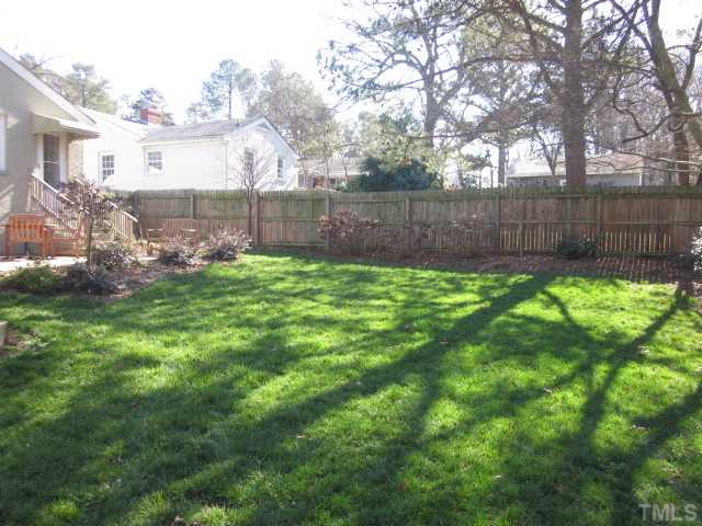 2031 Reaves Drive Raleigh, NC 27608 - Photo 10 of 25 Lovely landscaping all around your new home! Private fenced in back yard on corner lot! Walking distance to Fallon Park, Five Points and so much more!