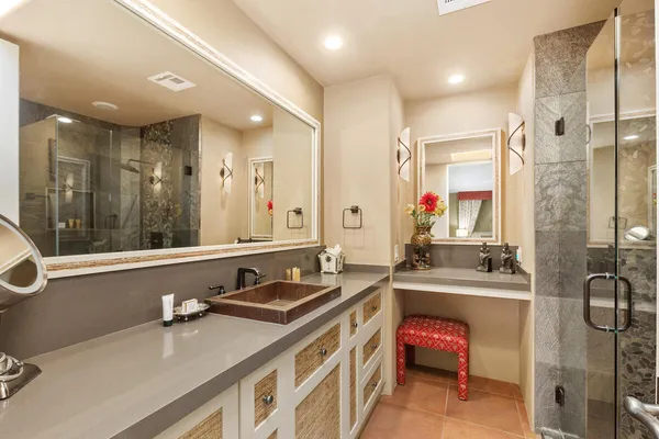 a bathroom with a sink double vanity and a shower