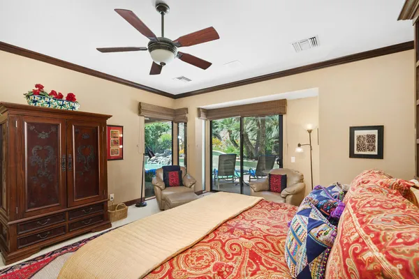 a bed room with a bed and a large window