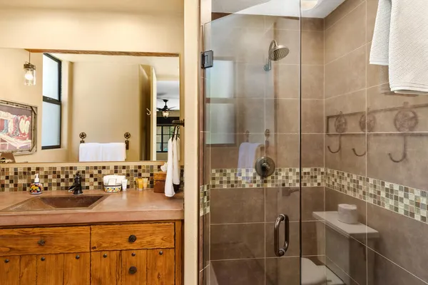 a bathroom with a shower and a sink