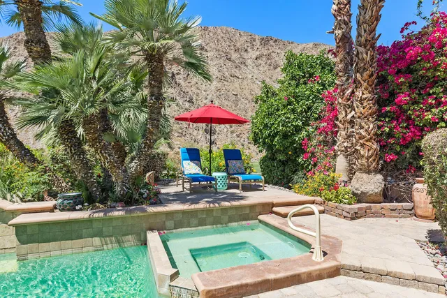 an outdoor space with patio furniture and white umbrellas