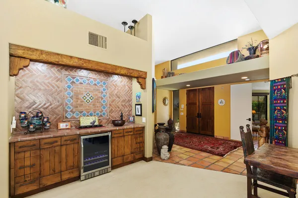 a open kitchen with stainless steel appliances granite countertop a stove a sink and a refrigerator