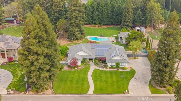 an aerial view of a house with outdoor space