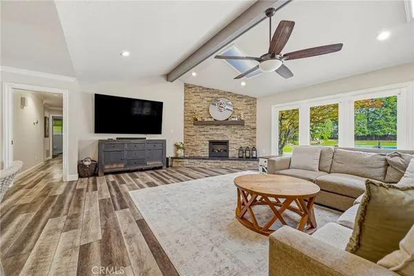a kitchen with a table chairs and white cabinets