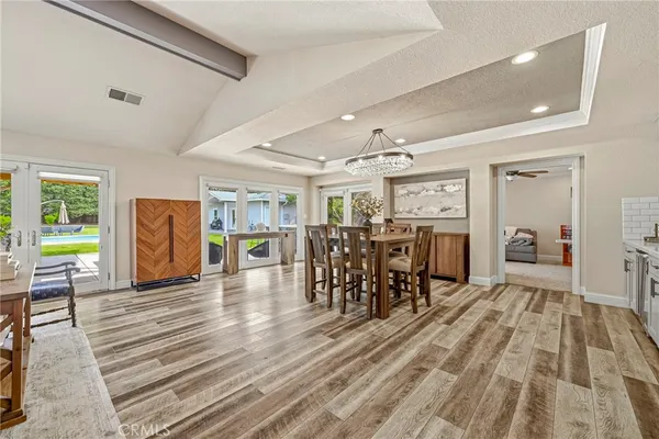 a view of a living room and dining room