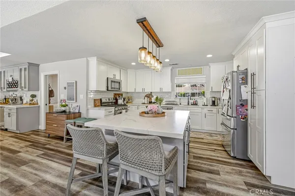 a kitchen with appliances cabinets and a sink