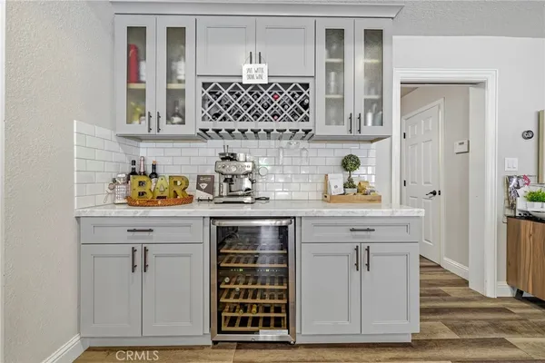 a living room with furniture gym equipment and a large window