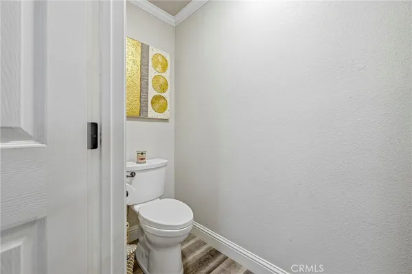 a spacious bathroom with a granite countertop sink mirror and toilet