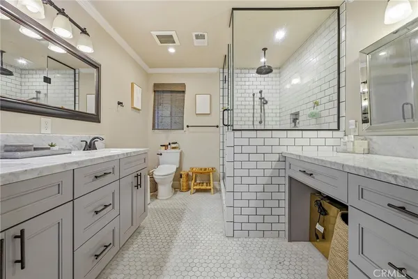 a view of a swimming pool with a table and chairs under an umbrella