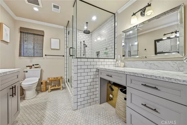 a view of a patio with table and chairs and potted plants