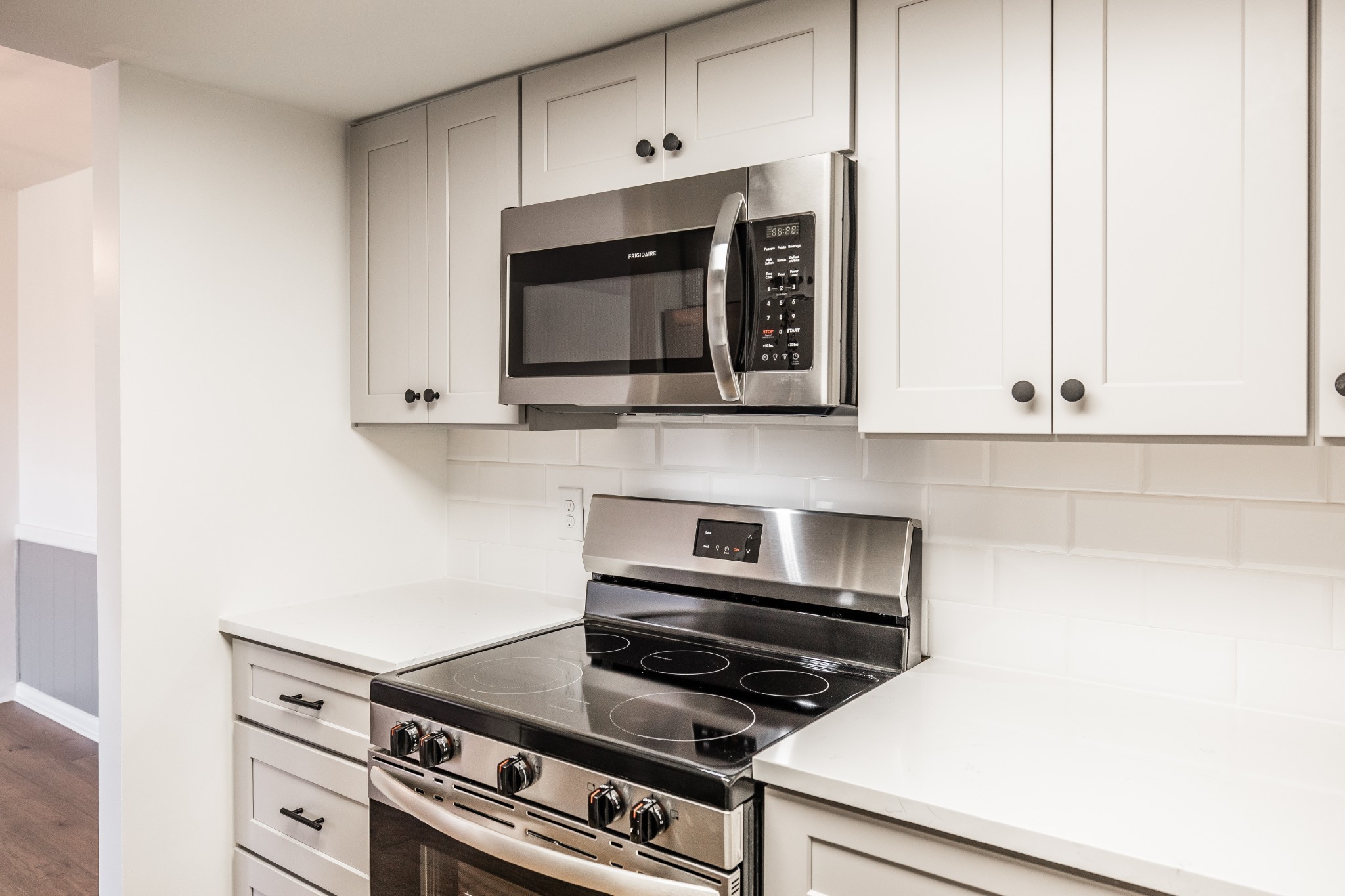 21 Vaughns Gap Road, Unit 55 Nashville, TN 37205 - Photo 14 of 35 a kitchen with granite countertop a stove and a microwave