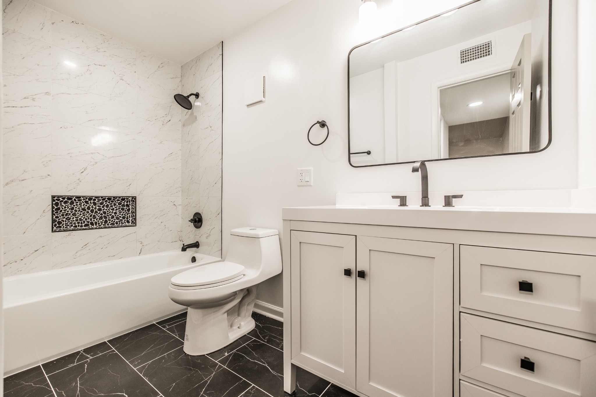 21 Vaughns Gap Road, Unit 55 Nashville, TN 37205 - Photo 23 of 35 a bathroom with a sink toilet a mirror and shower