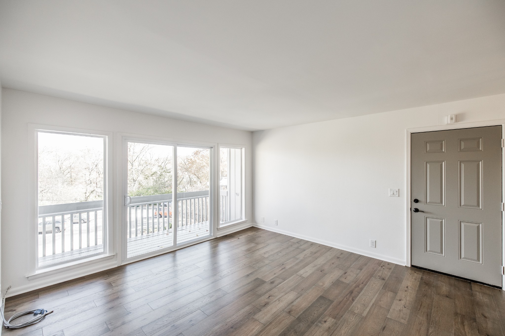 21 Vaughns Gap Road, Unit 55 Nashville, TN 37205 - Photo 8 of 35 wooden floor in an empty room with a window