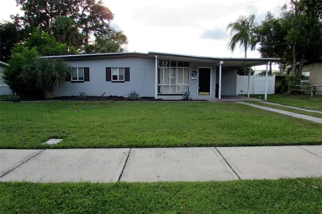 front view of house with a yard