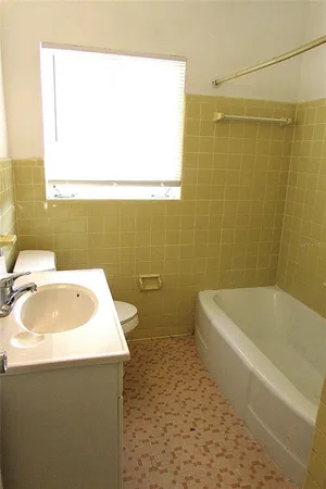 a bathroom with a sink and a bathtub