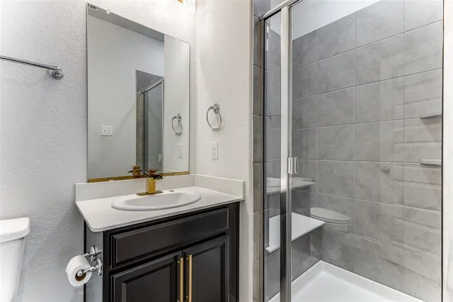 an empty room with closet and wooden floor