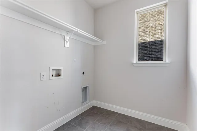 a view of a livingroom with a ceiling fan and window
