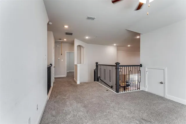a view of a hallway with a livingroom
