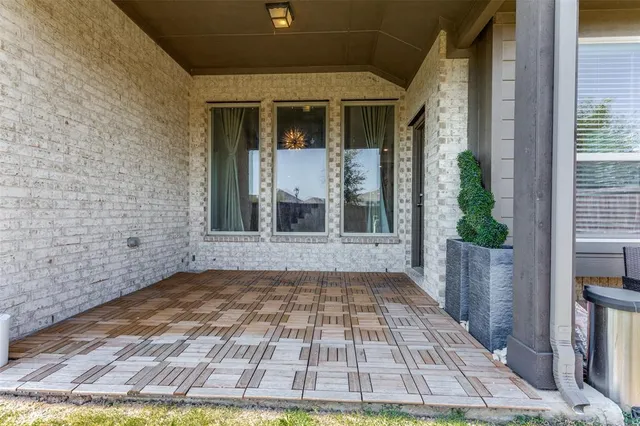 a view of a brick house with a yard