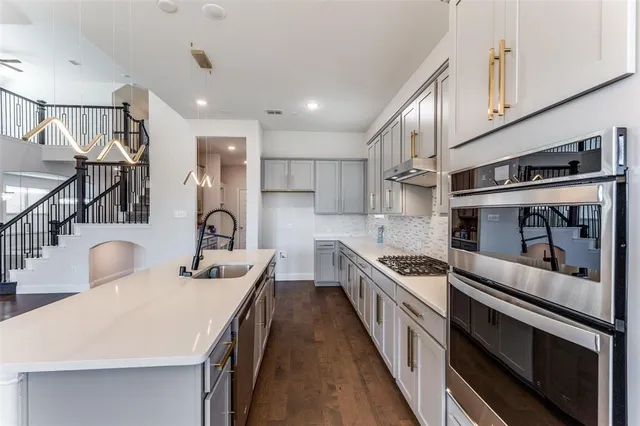 a view of kitchen with cabinets and wooden floor