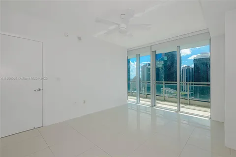 a view of empty room with floor to ceiling window