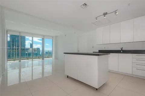 a view of a kitchen with dishwasher and cabinets