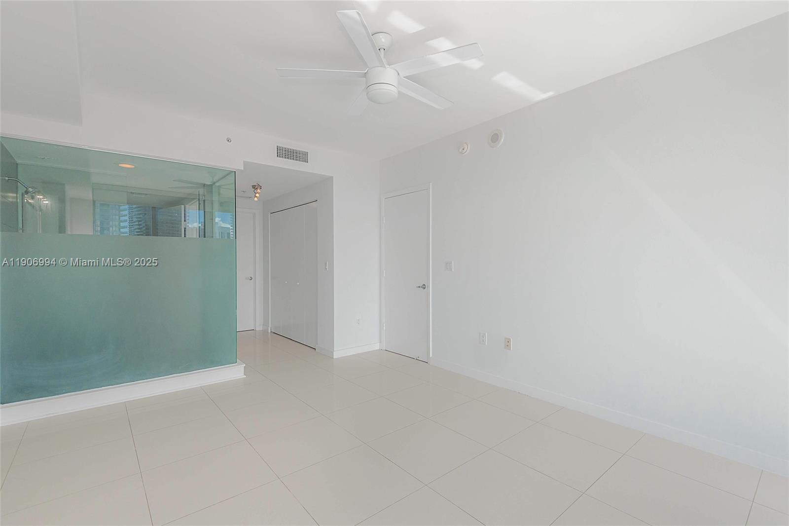 92 Southwest 3rd Street, Unit 3503 Miami, FL 33130 - Photo 22 of 35 an empty room with fan and entrance
