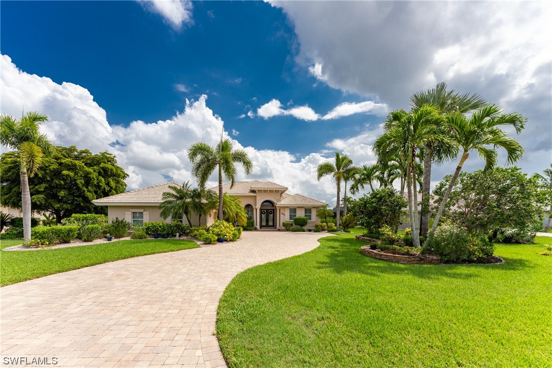 3290 Sugarloaf Key Road Punta Gorda, FL 33955 - Photo 1 of 50 a view of a garden with a building in the background