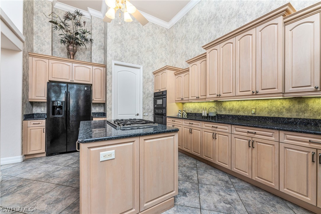 3290 Sugarloaf Key Road Punta Gorda, FL 33955 - Photo 12 of 50 a kitchen with stainless steel appliances granite countertop a stove a refrigerator and a sink