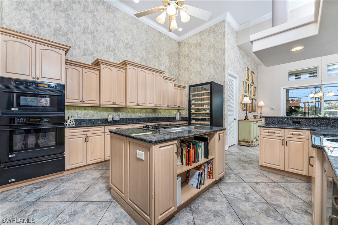3290 Sugarloaf Key Road Punta Gorda, FL 33955 - Photo 13 of 50 a kitchen with stainless steel appliances granite countertop a stove and cabinets