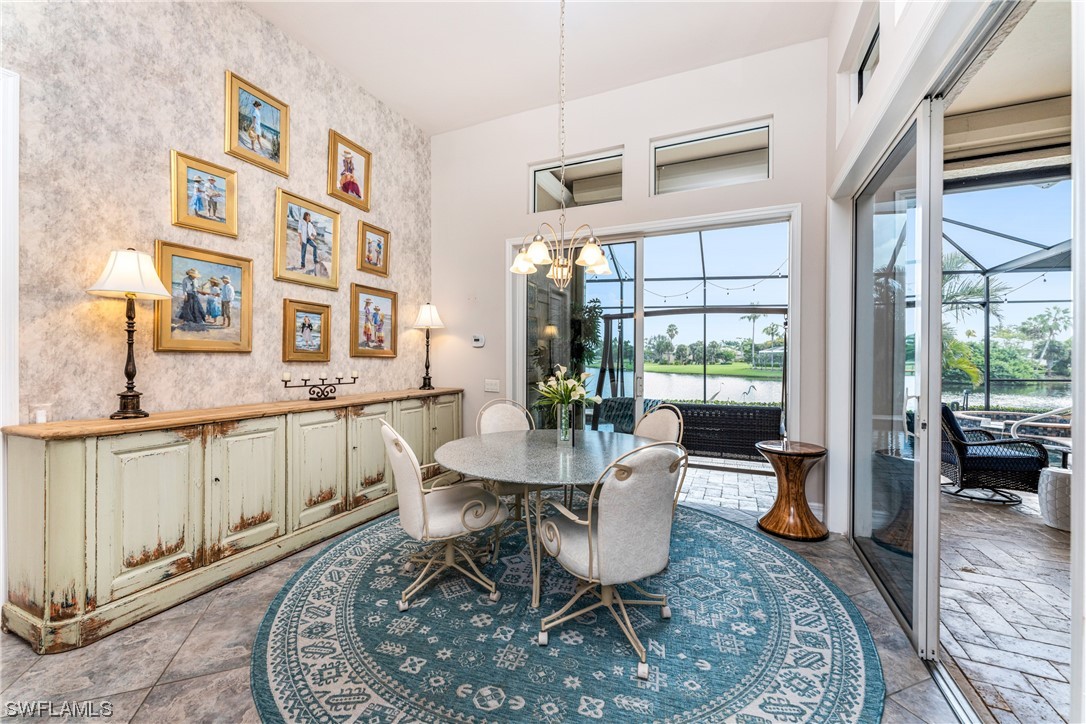 3290 Sugarloaf Key Road Punta Gorda, FL 33955 - Photo 15 of 50 a dining room with furniture a rug wooden floor and a rug