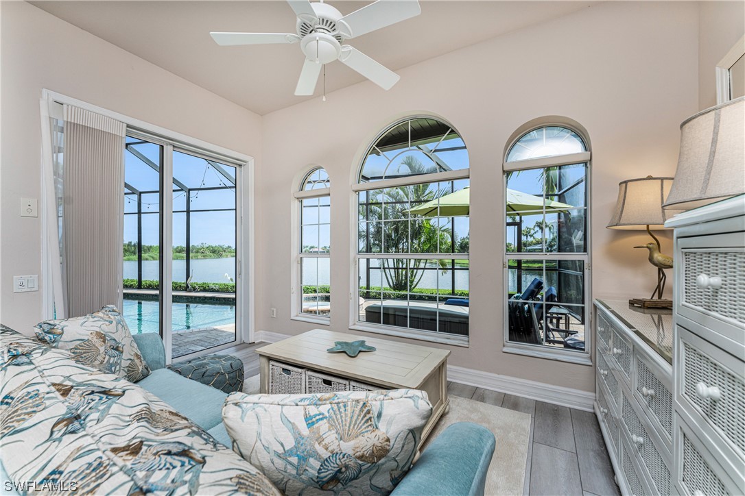 3290 Sugarloaf Key Road Punta Gorda, FL 33955 - Photo 20 of 50 a living room with furniture and large windows