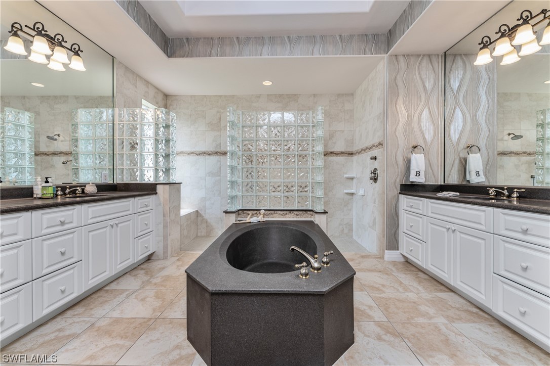 3290 Sugarloaf Key Road Punta Gorda, FL 33955 - Photo 23 of 50 a large bathroom with a sink a granite counter top and a sink