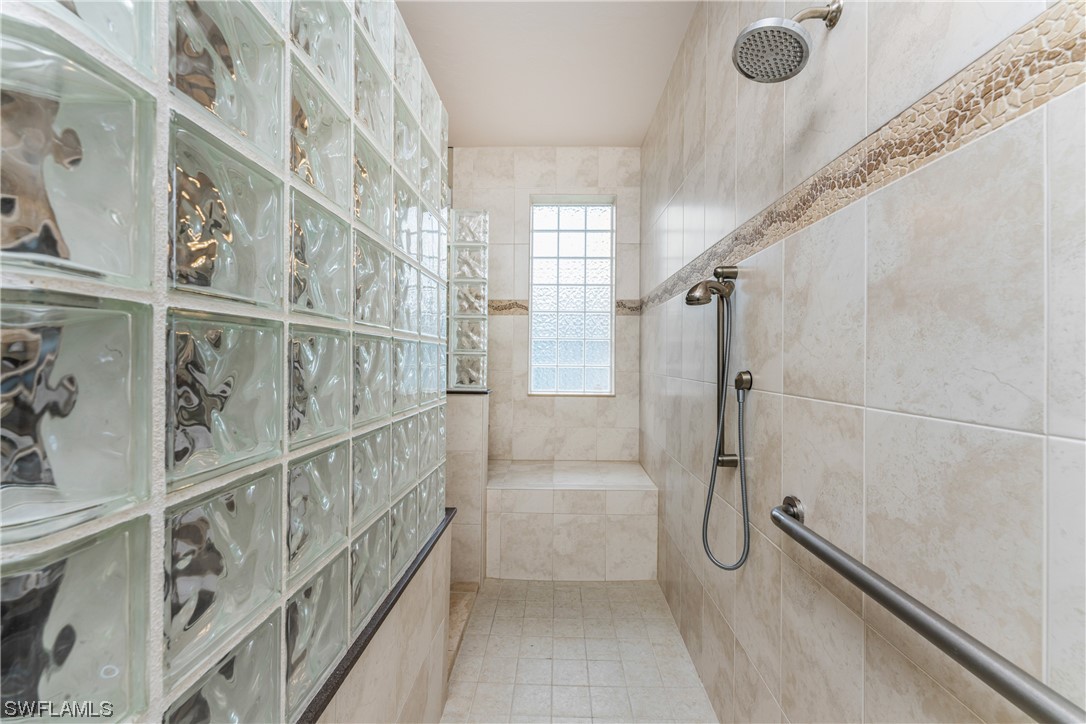 3290 Sugarloaf Key Road Punta Gorda, FL 33955 - Photo 26 of 50 a bathroom with a tub and a shower